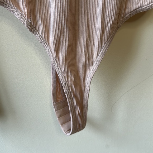 Out from under bodysuit - Picture 3 of 3